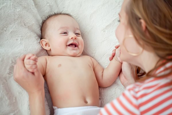 When do babies stop clenching their fists?
