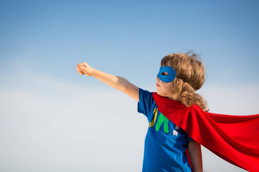 boy wearing a superhero costume