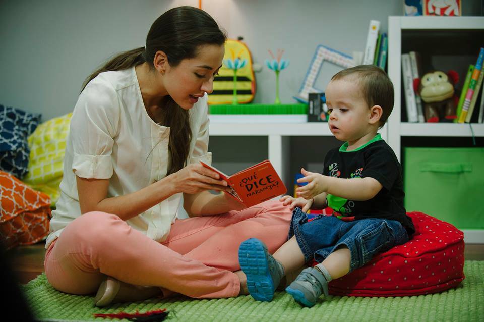 Mom reading to her baby to help them with separation anxiety