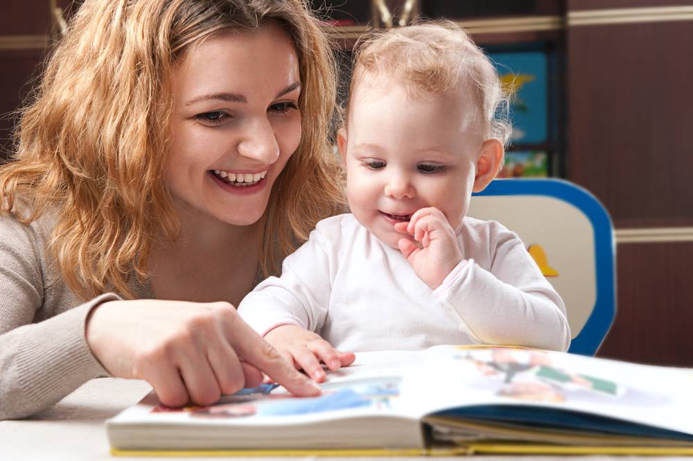 mom and baby reading a book