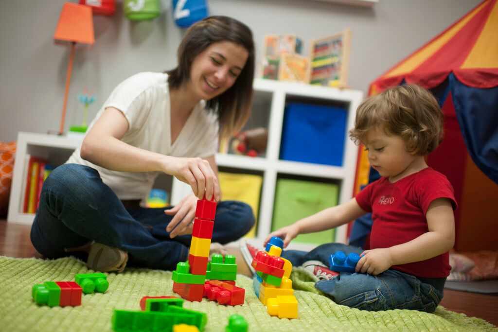 little boy and mom playing with age-appropriate toys