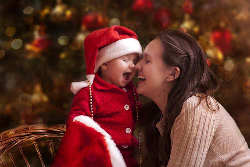 Mom and child with Christmas tree