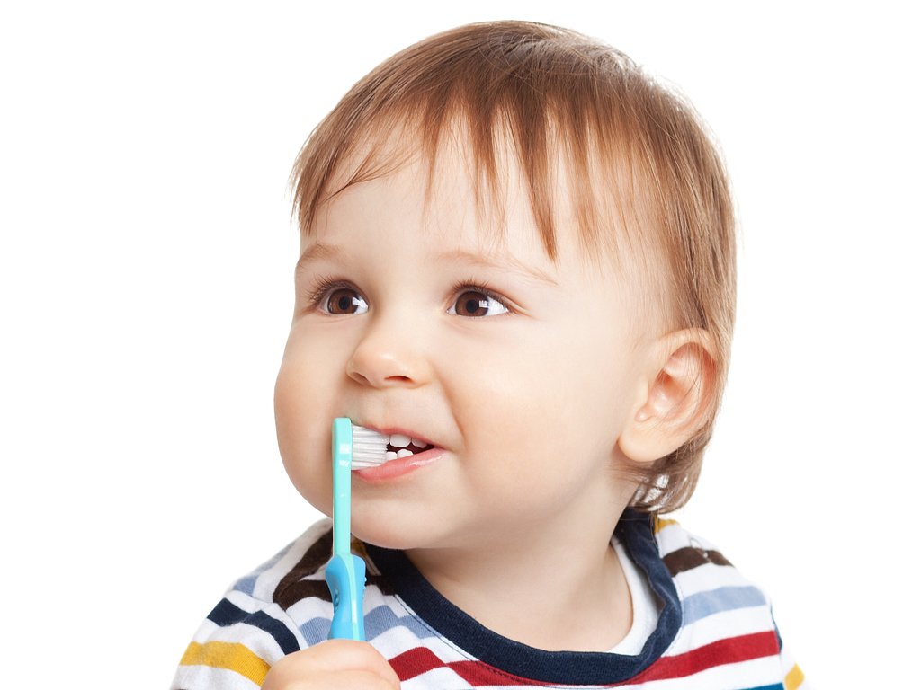 baby brushing his teeth