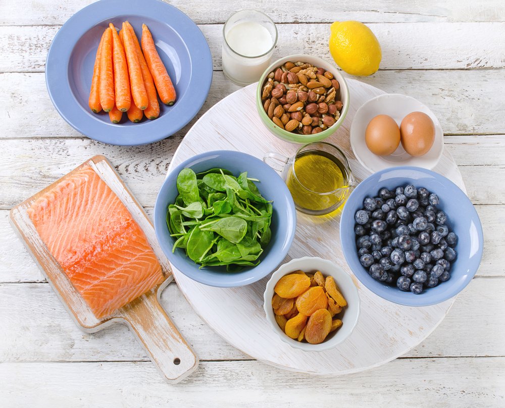 healthy foods like salmon, blueberries, carrots, etc.