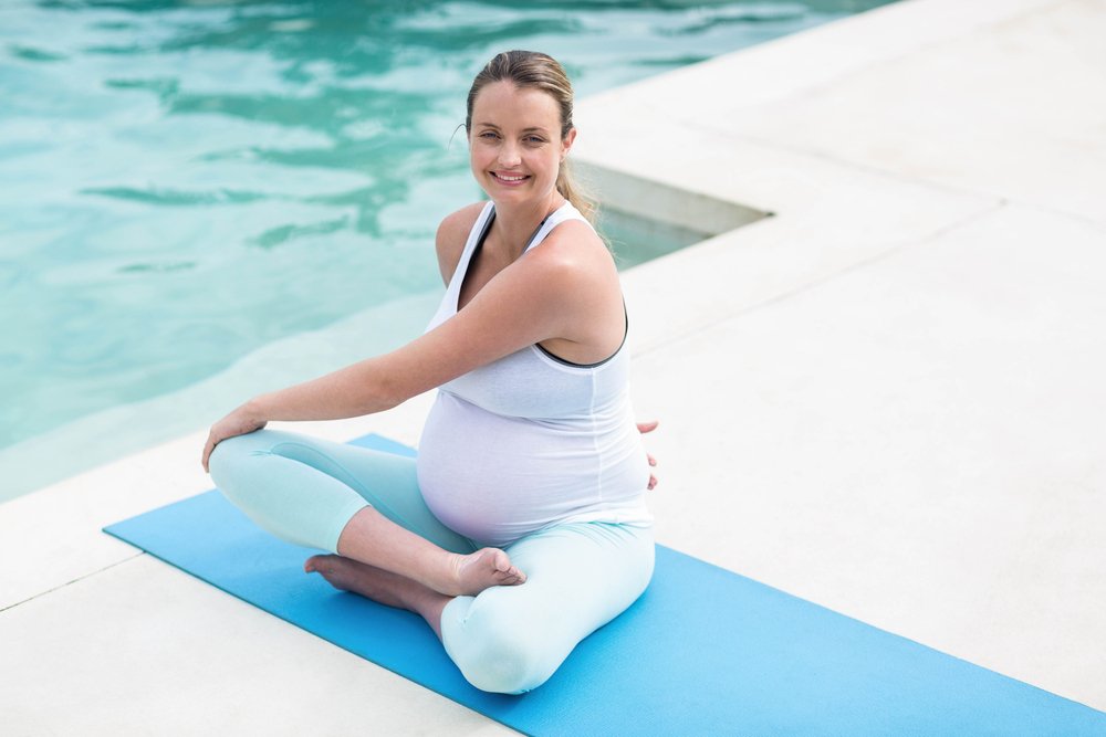 pregnant woman doing yoga