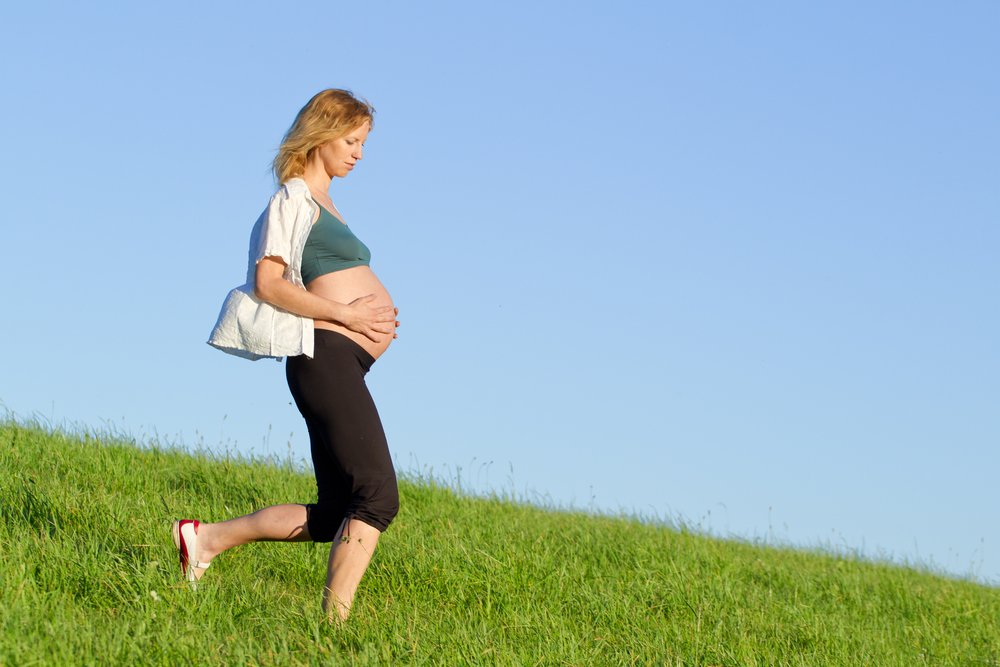 pregnant woman having a stroll in the nature