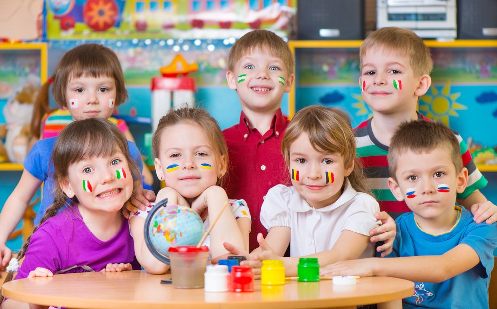 children with flags drawn on their cheeks