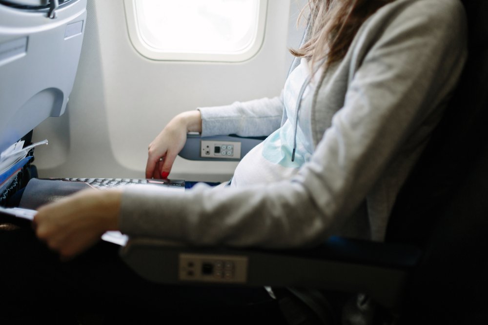 pregnant woman on a plane