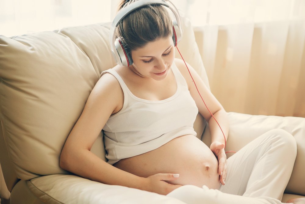 pregnant woman listening to music