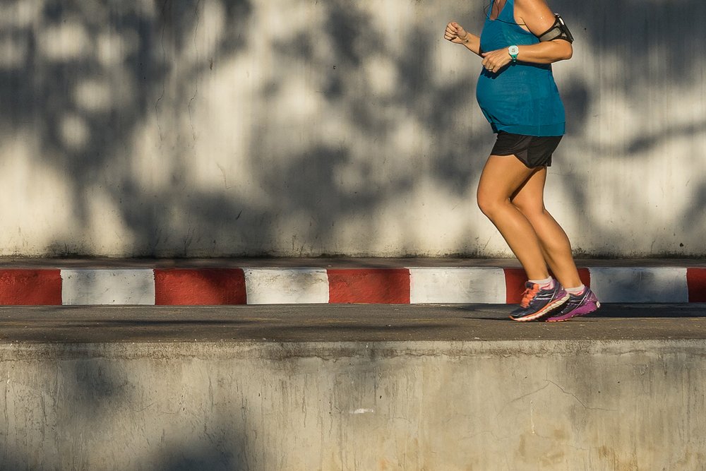 pregnant woman running