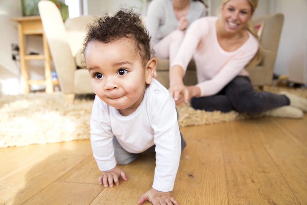 baby crawling away from mom