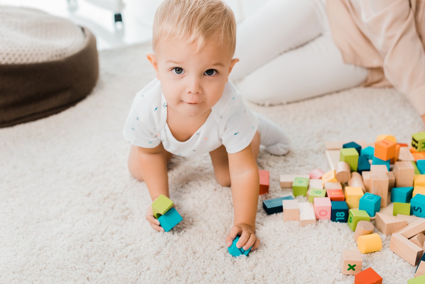 baby boy playing on the floor