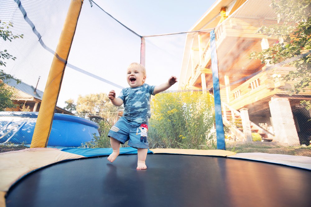 baby jumping on a trampoline