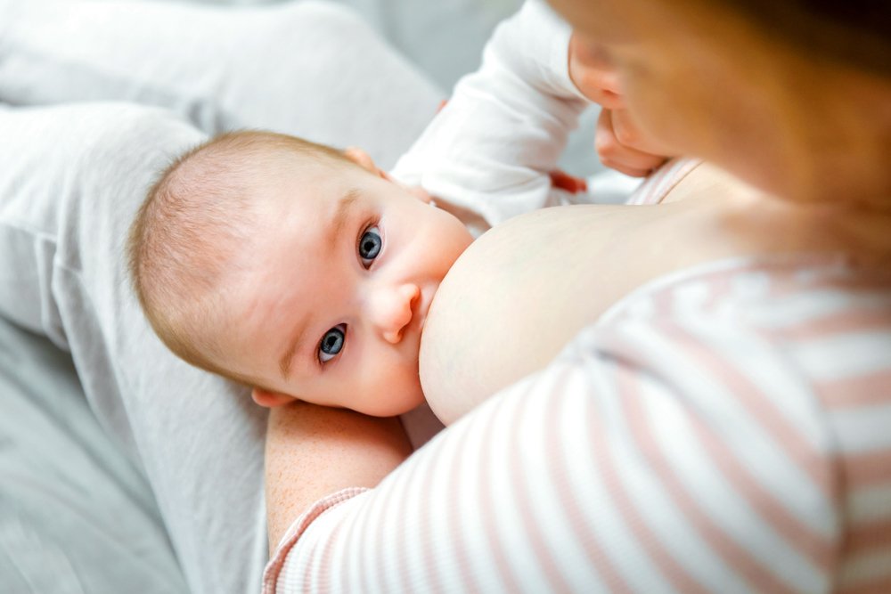 mother breastfeeding her baby girl