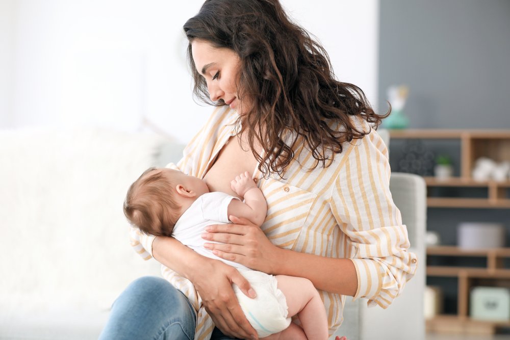 woman breastfeeding her baby