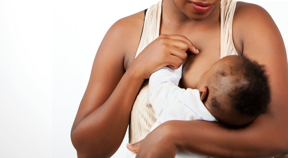 woman breastfeeding her baby