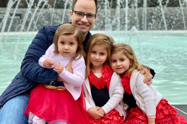 Happy father with his 3 daughters