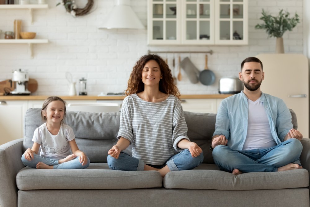 family meditating and relaxing