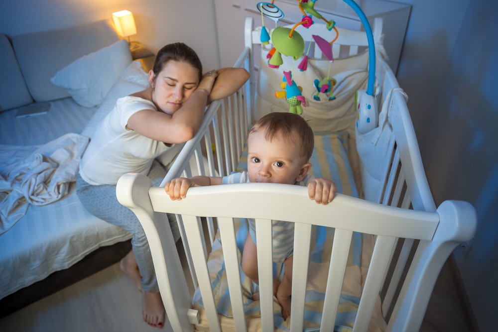 exhausted mother because of her baby not sleeping