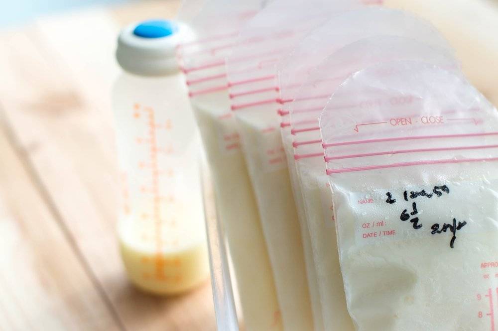 can warmed breast milk be refrigerated again?