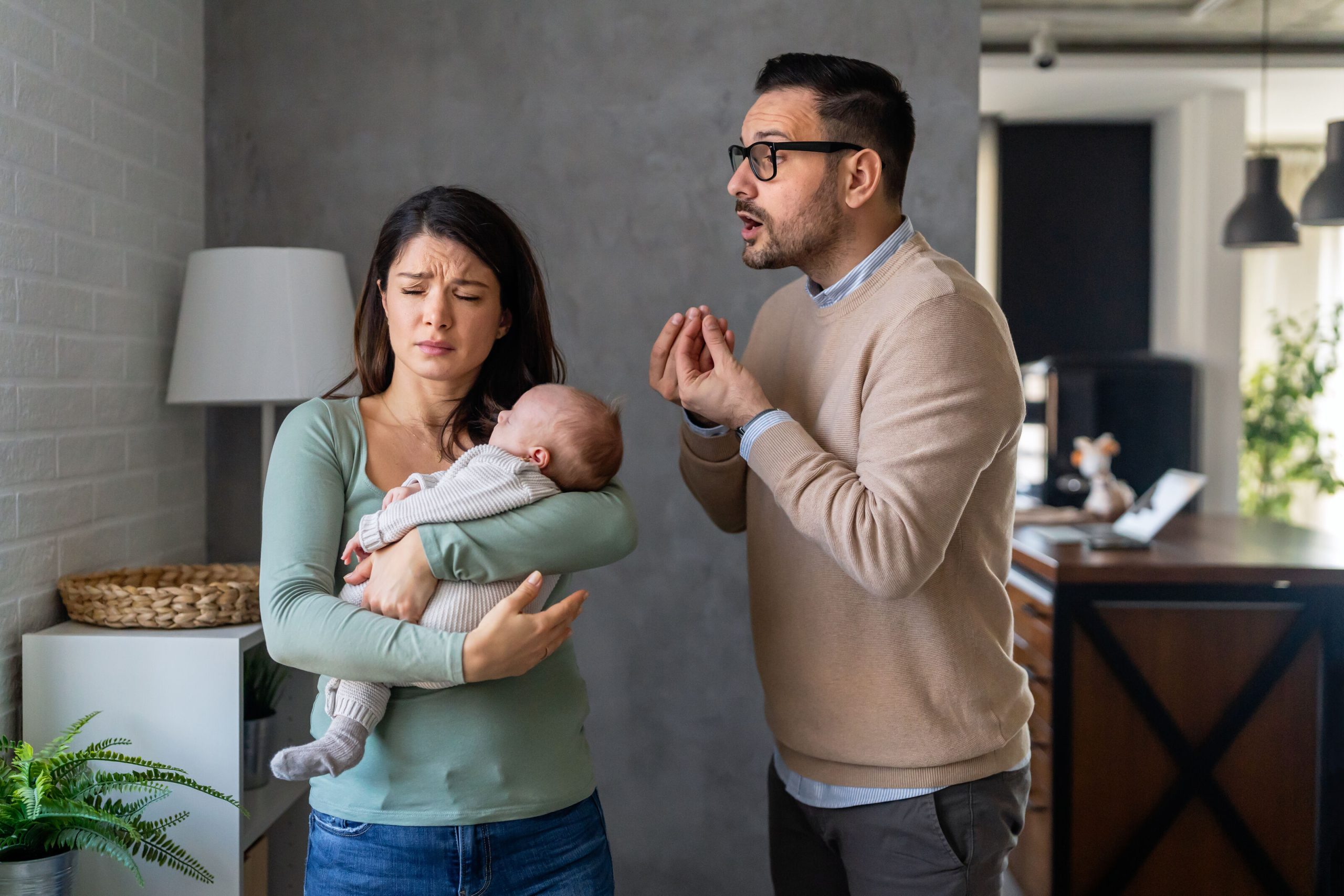 Couple discussing after newborn birth